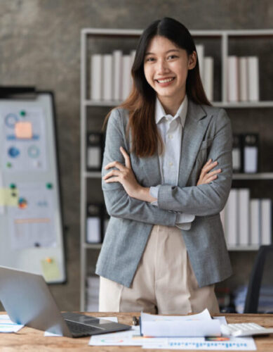 Smart Asian Business Woman smiling in office